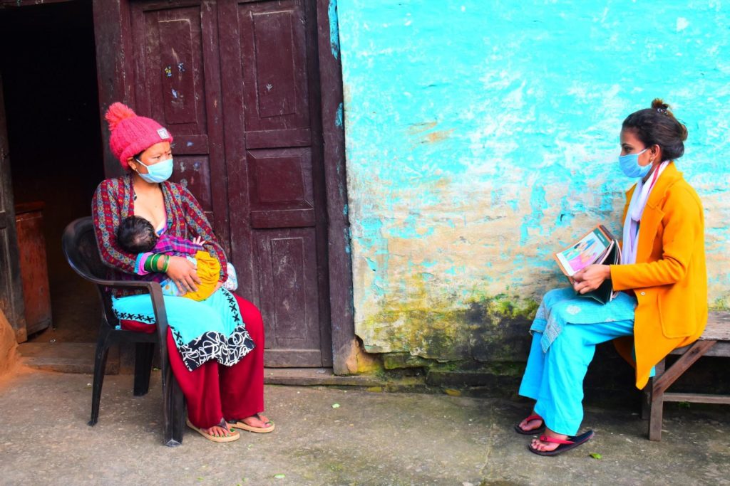 In Nepal, community health volunteers conduct social distanced breastfeeding counseling so new mothers can overcome breastfeeding challenges while limiting exposure to COVID-19. Photo: USAID/Nepa
