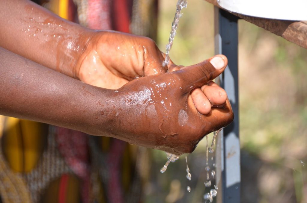 Washing hands. Photo: Matteo Cosorich, WFP